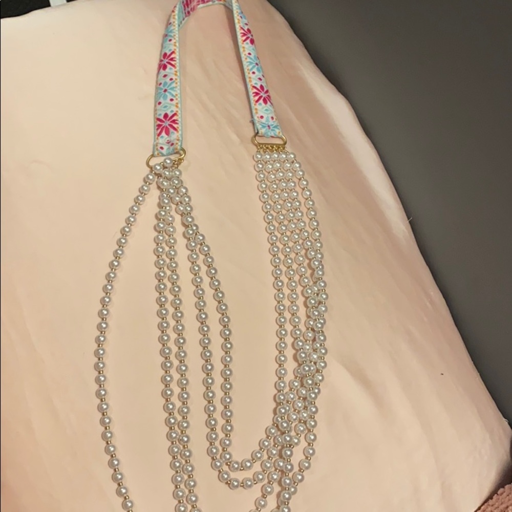 Plunder pearls with gold beads. Fabric necklace